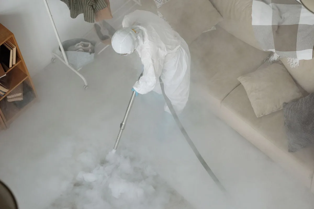 Biohazard cleanup technician in protective equipment, Glenwood, MN